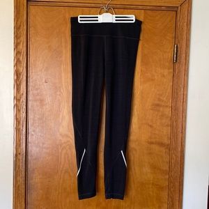 Women’s Fila running pants in black, size medium.